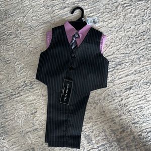 Set of vest, shirt and tie with trousers.
